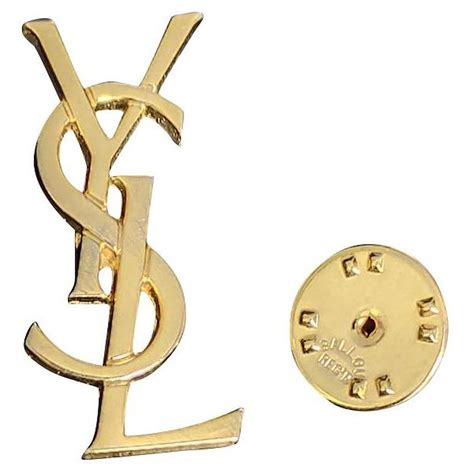 Broches Yves Saint Laurent occasion .